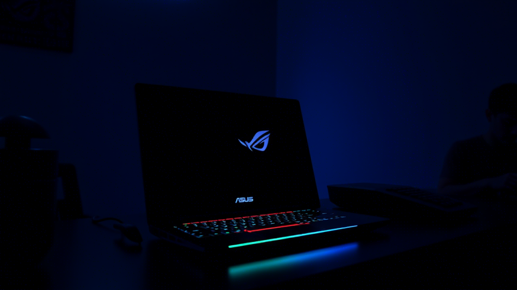 ASUS ROG Strix Scar 16 in a dark room with RGB lighting glowing